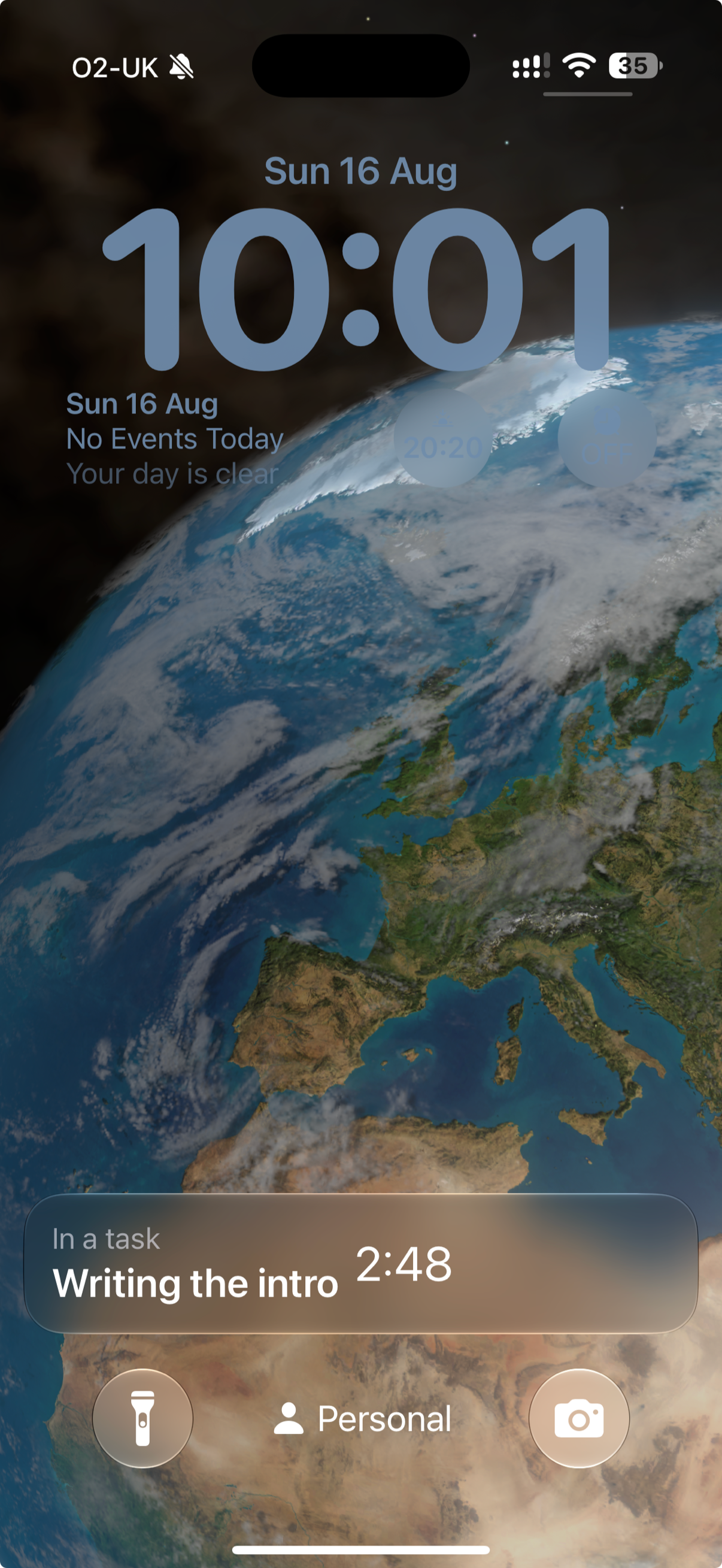 The iPhone Lock Screen showing a running task as a Live Activity card.